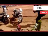 Stuntwoman tries to stand on moving motorbike but loses control | SWNS TV