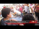 انصار المعزول يحطمون زجاج السيارات بشارع الهرم