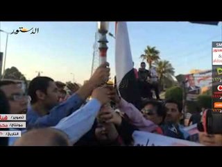 والدة الشهيد أبو شقرة تقوم بإشعال شعلة حملة السيسى بالفيوم