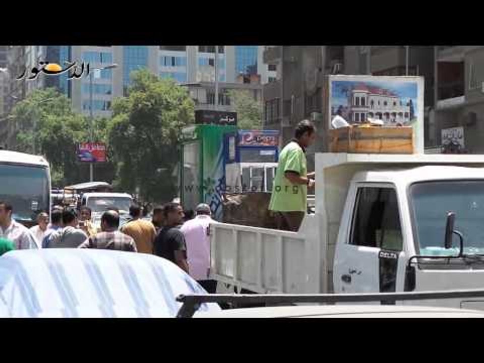 حملة أمنية لرفع إشغالات الطريق بالدقى