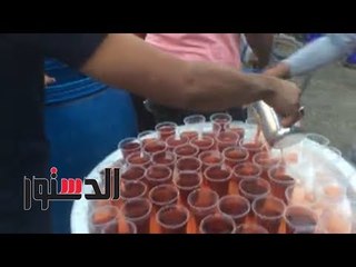 الدستور | توزيع المثلجات والمياه عادة جديدة فى المولد بأسوان