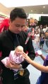 Amazing talented of person with baby poppet in shopping mall...