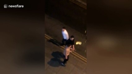 Wahey! Student tumbles after friend smacks takeaway out of his hand