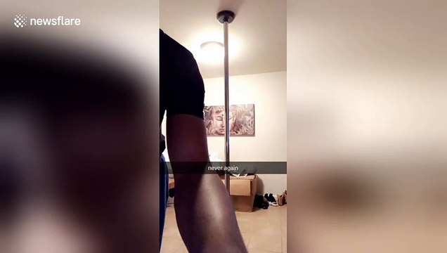 Man tries out pole dancing for the first time but ends up on the floor