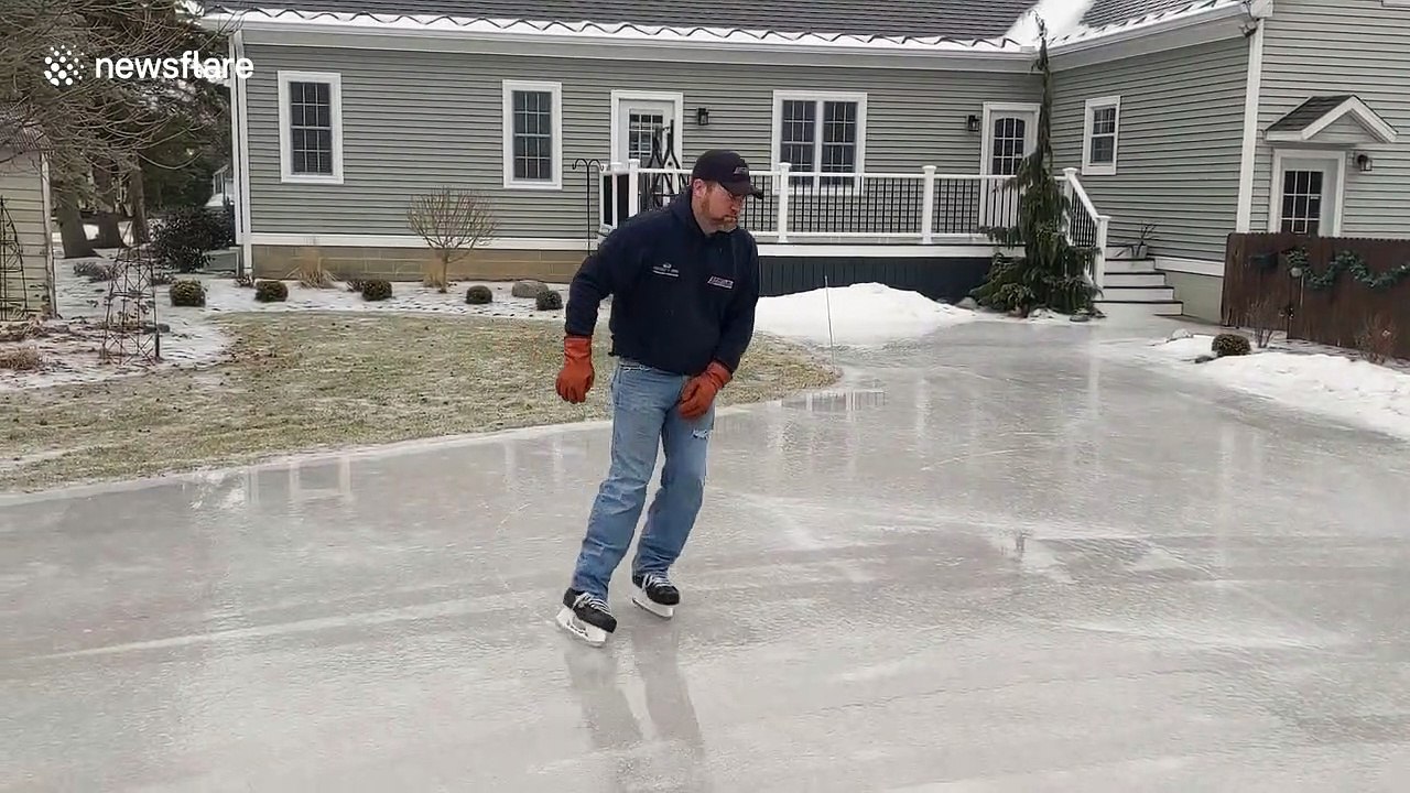 Michigan man skates gracefully on frozen driveway during recent polar vortex