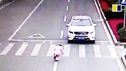 Polite little girl bows to courteous driver who stopped for her