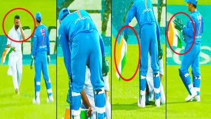 தேசியக் கொடியை கீழே விழாமல் காத்த தோனி!- வீடியோ