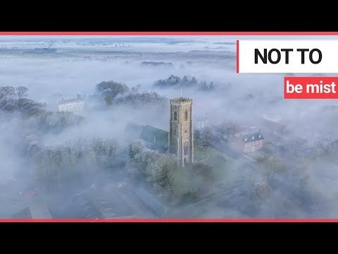 Stunning footage captures church spire piercing thick 'radiation fog' covering village | SWNS TV