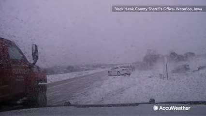 Car loses control on snowy road, plows into police car