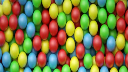 Multicolored candy, dragee on a plate, close-up. The plate rotates.