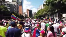 Thousands of Venezuelans march in Caracas to demand humanitarian aid be allowed to enter country