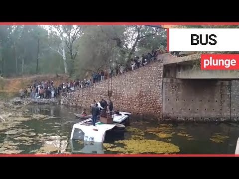 Passengers lifted to safety by crane after bus falls into open drain | SWNS TV