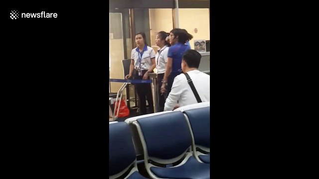 Furious Thai airport worker yells at tourist in row over hand luggage allowance