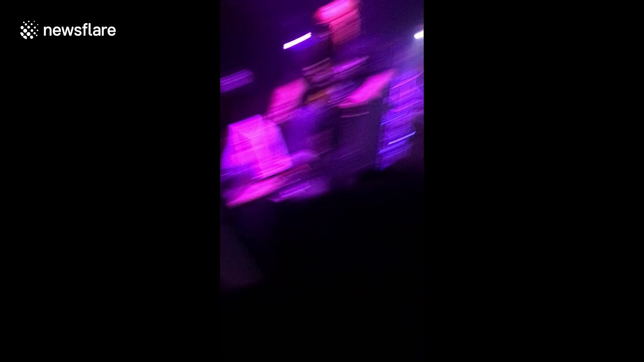 US rapper Talib Kweli "drop-kicks" fan after performing freestyle