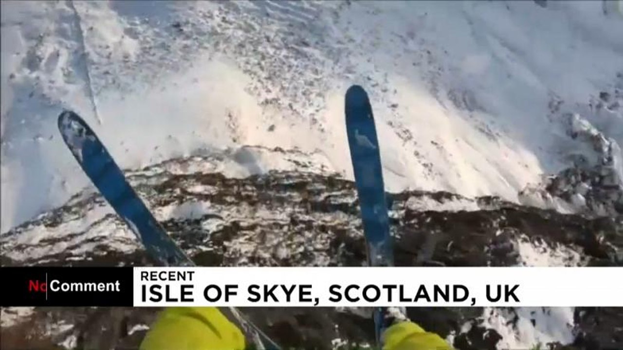 Daredevil base jumper performs outrageous leaps on Scottish mountains
