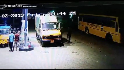 Incredibly brave men push truck on fire away from petrol station