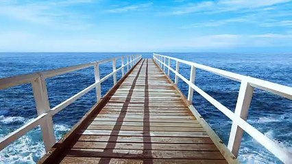 4k bridge extending into the ocean