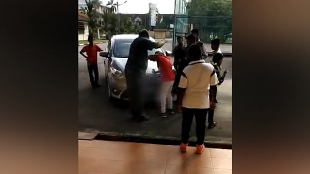 Cops identify man in video hitting boy for sticking chewing gum on car