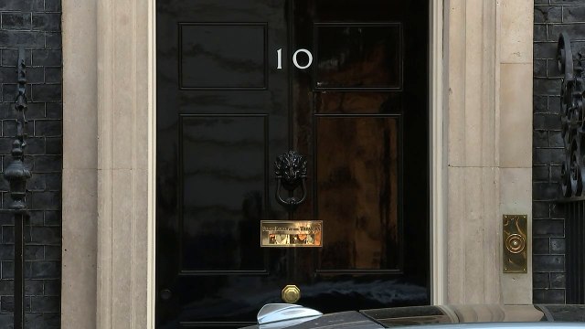 Theresa May heads to Parliament for PMQs