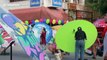 Graffiti artists spray paint contemporary designs on ancient Thai umbrellas