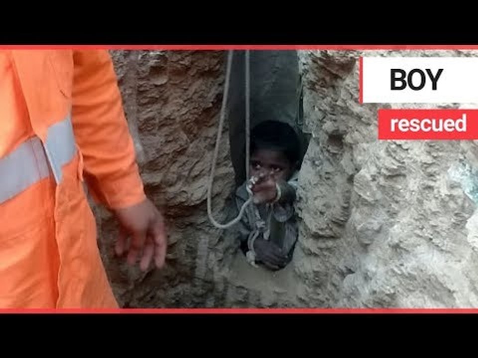 Six-year-old boy is pulled to safety 16 hours after he fell down 200ft construction hole | SWNS TV