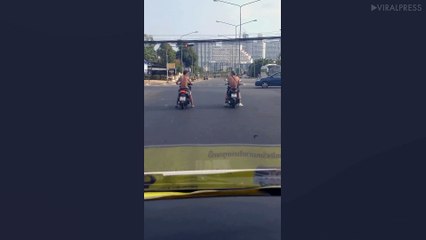 Tourists Doing Wheelies On Their Rented Motorcycles