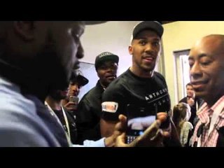 KEVIN JOHNSON BANTERS WITH ANTHONY JOSHUA IN THE CORRIDOR AS PAIR MEET AFTER WEIGH-IN .