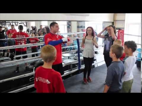 TOMMY COYLE ENTERTAINS THE KIDS OF HULL WITH A GAME OF 'HEADS & TAILS' & GIVES THE WINNERS TICKETS