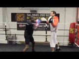 UNDEFEATED PROSPECT OHARA DAVIES (7 WINS, 5 KO'S)  & TRAINER TONY SIMS WORK THE PADS.
