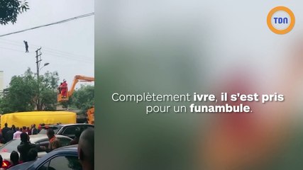 Un funambule ivre est en équilibre sur des câbles électriques