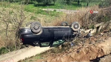 Takla atıp tarlaya uçan araçtan sağ çıktı