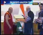 PM Modi presents 'Urga Kanjur' to Head Priest, Datsan Gunzechoinei Buddhist Temple