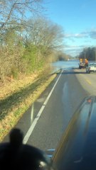 Truck Fords Through Flooded Roadway