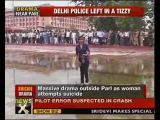 Download Video: Woman attempts suicide outside Parliament - NewsX