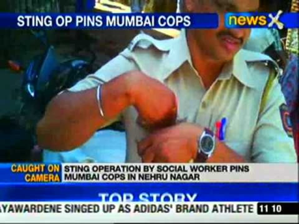 Mumbai cops caught on camera accepting bribe, s...
