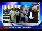 BJP poll committee chief Modi speaks to Advani