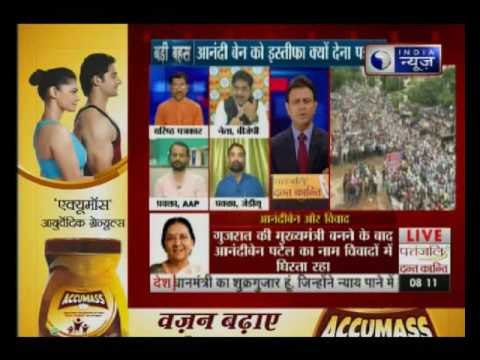 Why did Anandiben Patel resigns as the Gujarat Chief Minister?