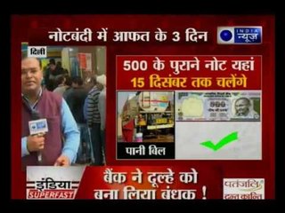 32 days later, people still stand in queues outside banks and ATMs for money