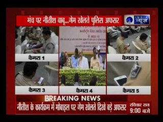 Police officers' plays 'Candy Crush' in a meeting called by Nitish Kumar to tackle drug smuggling