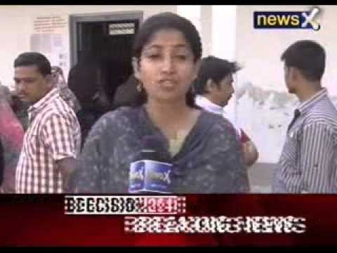 Ajay Rai flashes Congress symbol outside polling booth