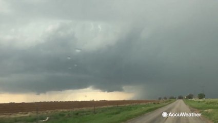 Lightning strikes in front of wall cloud