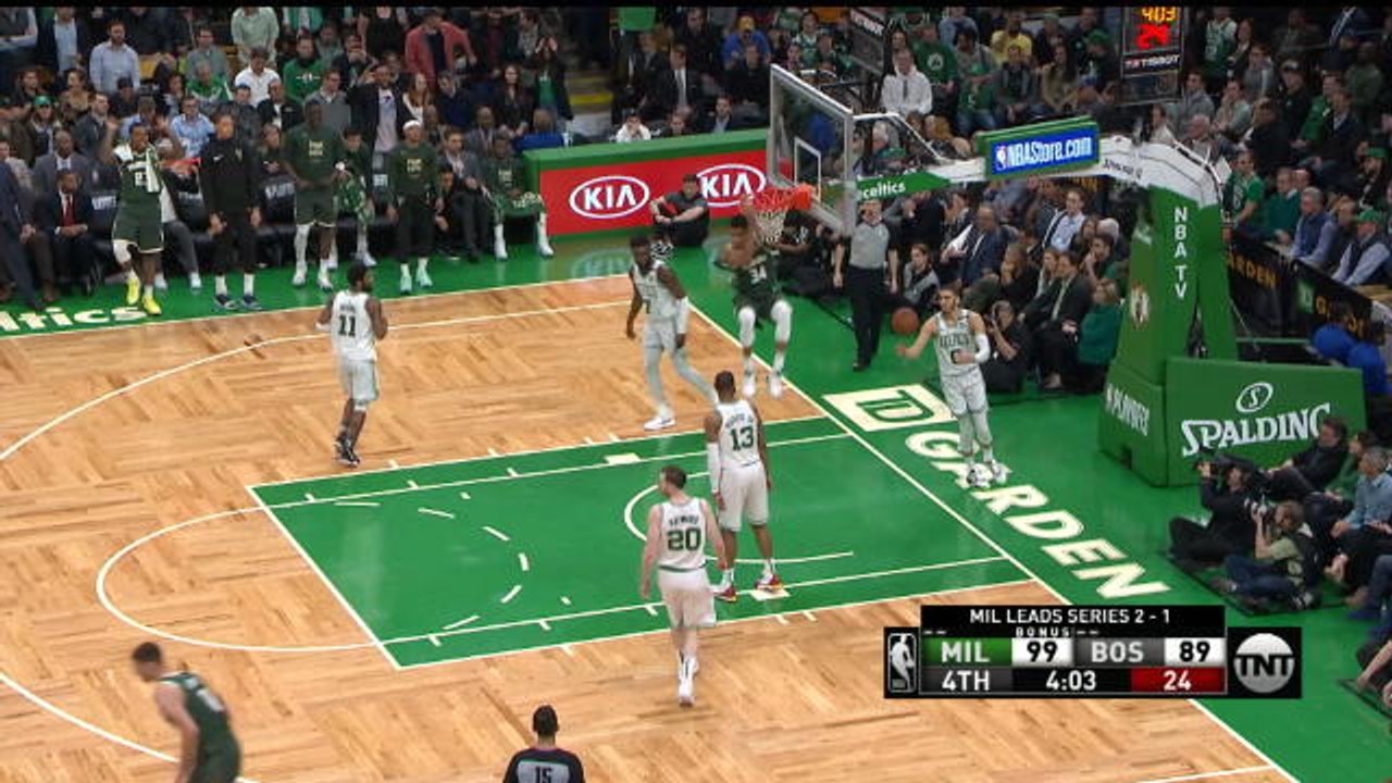Giannis spins and slams a dunk
