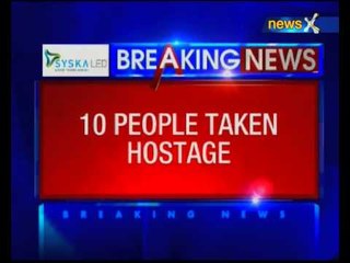 Gunmen hold up store with some 10 people inside near Paris