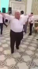 Fat man dancing funny at a wedding