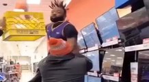 Man runs through Walmart, dunking on people, yelling 
