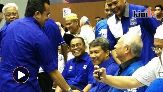 Najib is all smiles after arriving to celebrate BN's victory in Semenyih