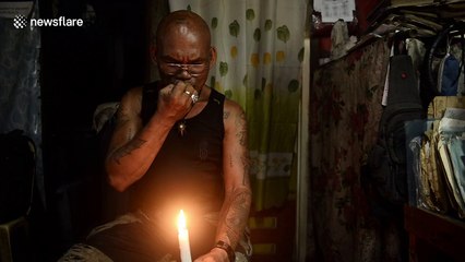 Filipino man coats arm in hot wax in bizarre ritual