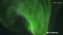 Northern Lights dance across the night sky in Finland