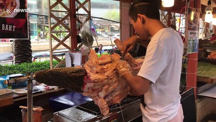 Crikey! Grilled crocodile on display in Thai shopping mall