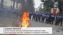Albanian protesters burn tires, throw smoke bombs, urge PM to step down